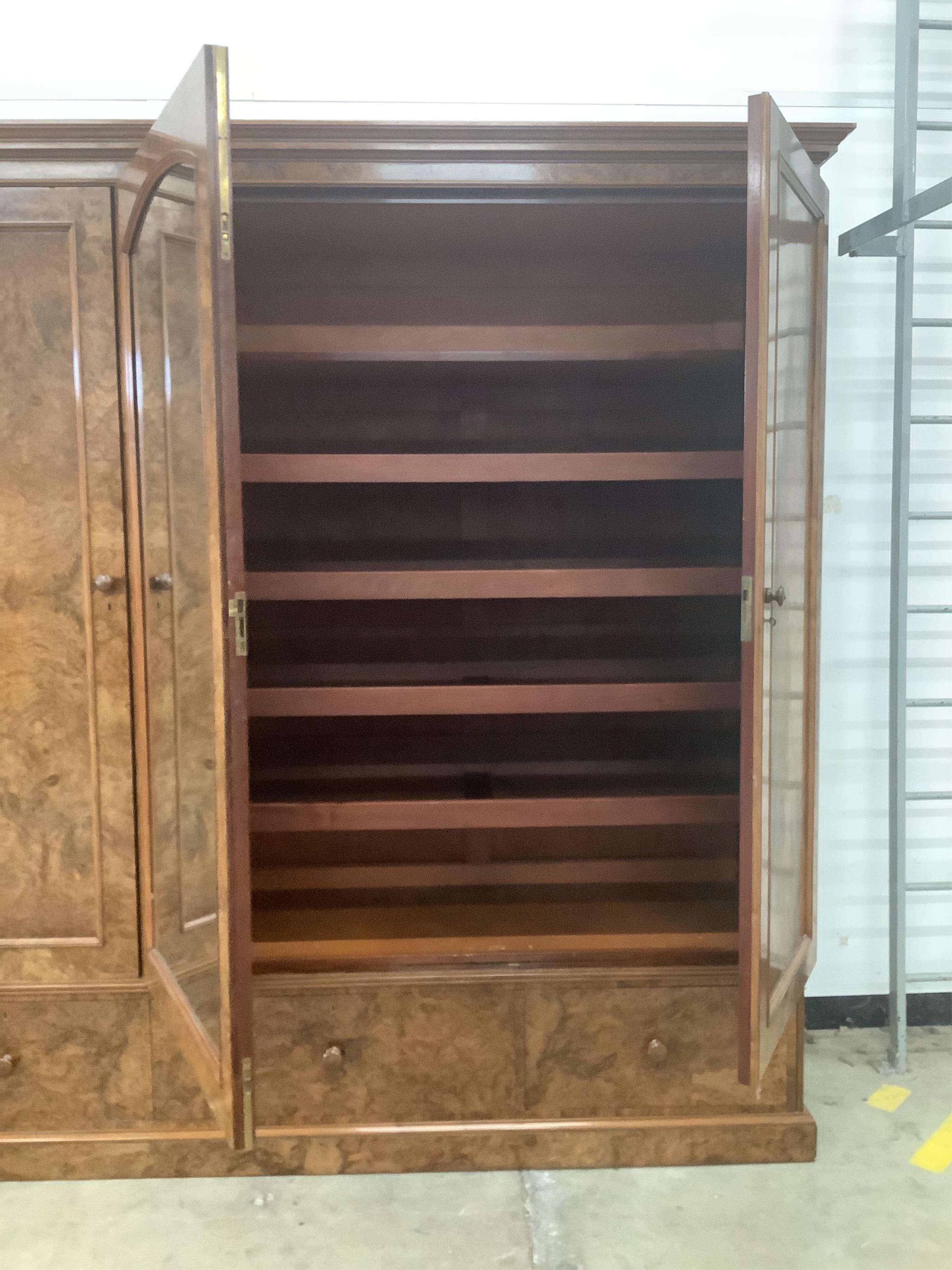 Holland & Sons, a Victorian burr walnut triple mirrored compactum wardrobe, width 225cm, depth 62cm, height 228cm. Condition - good